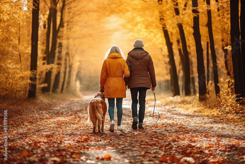 Middle-aged couple with a dog walks on an autumn park. Generated by AI © Renata Hamuda