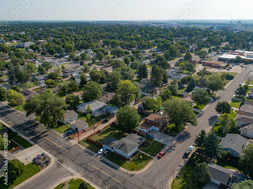 Fototapeta Naklejka Na Ścianę i Meble -  Sterling colorado summer aerial view trees are green residential area. 