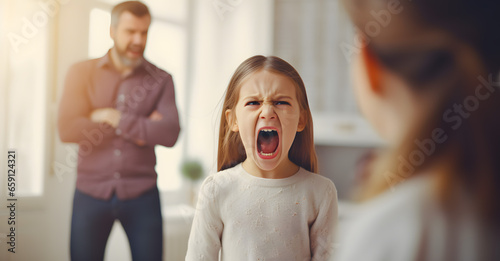 Parental Quarrel. Arab Man And Woman Arguing In Front Of Their Child, Upset Little Girl Stressed Female Kid Sitting Between Shouting Parents photo