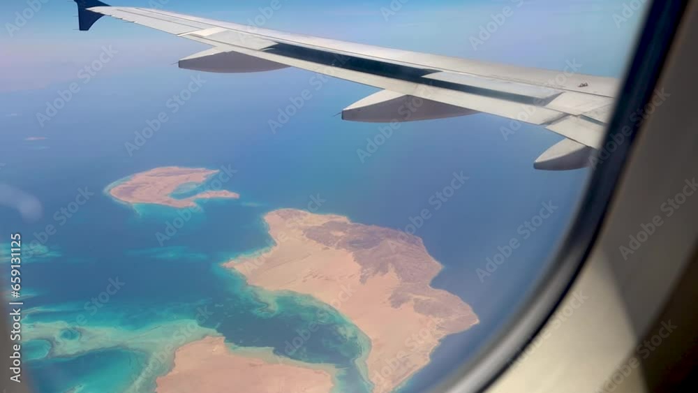 Turquoise islands in the Red Sea from airplane window Turquoise islands in the Red Sea from airplane window