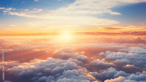 From the airplane's cabin, a breathtaking view of the sun setting in a sky filled with clouds, casting a dramatic glow.