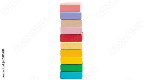 Colorful blocks stacked high in a tower, ready to topple isolated