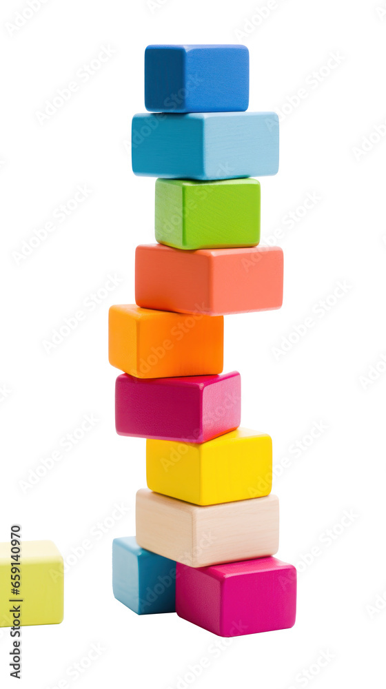 Fototapeta premium Colorful blocks stacked high in a tower, ready to topple isolated
