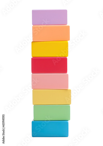 Colorful blocks stacked high in a tower, ready to topple isolated