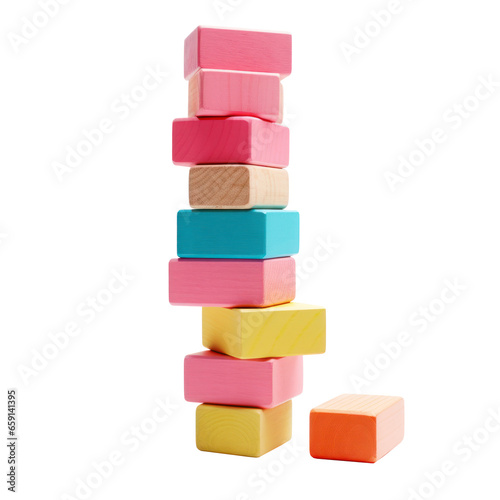 Colorful blocks stacked high in a tower, ready to topple isolated