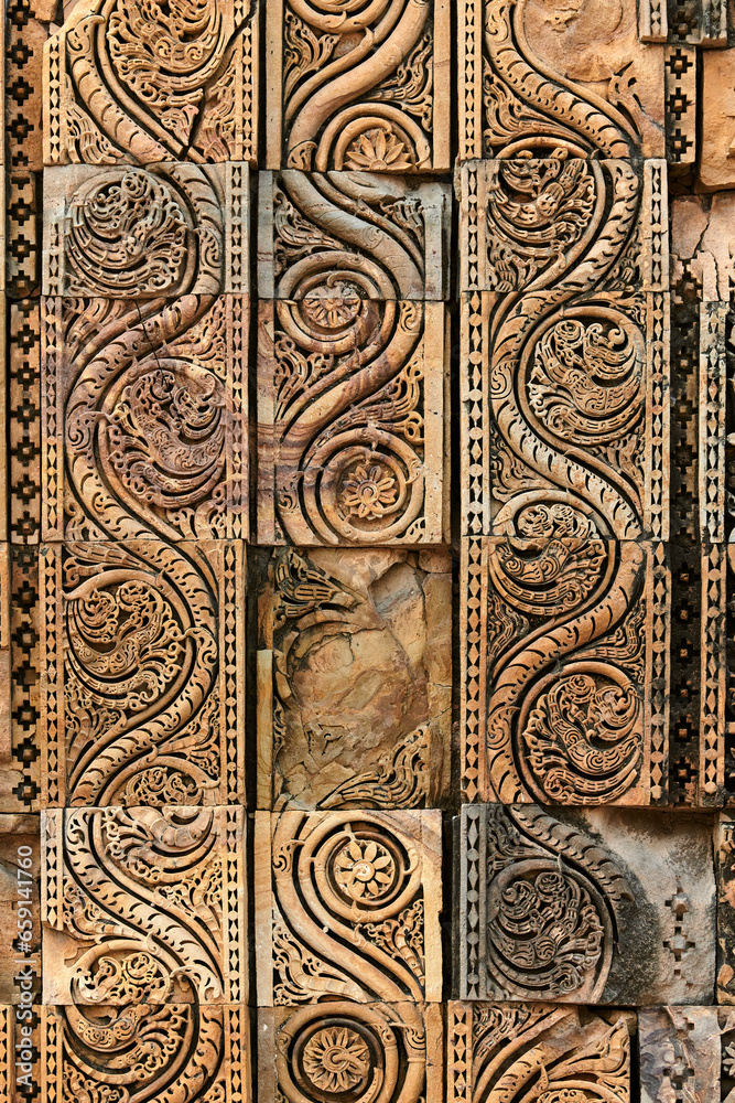 Wall decorative patterns of Qutb complex in South Delhi, India, close up ancient bas relief
