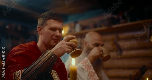 dwellers of medieval village of slavic settlement, portrait of three men drinking alcohol, 4K Prores