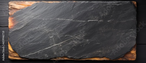 Panel kuchenny z motywem Top view of a dark stone texture with a black slate board for menu or recipe