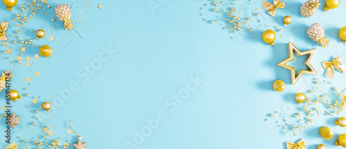 Christmas minimal composition. Xmas festive golden decorations on blue  background. Christmas  New Year  winter concept. Flat lay  top view  copy space