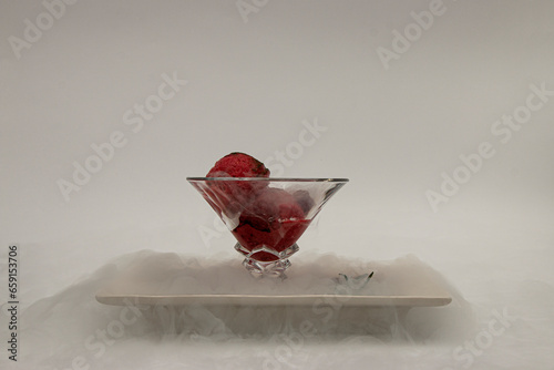 ice cream in a cup, in a white plate in a fog of liquid nitrogen four
