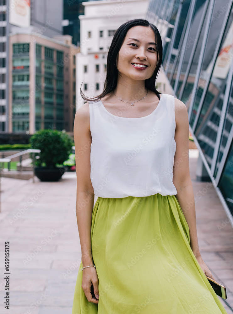 Smiling Asian woman looking at camera