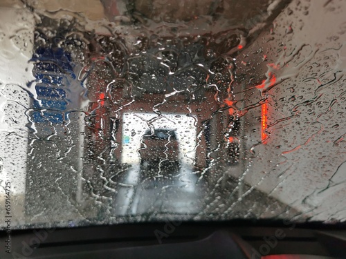 Automatic Car Wash Process. Car wash view from the salon