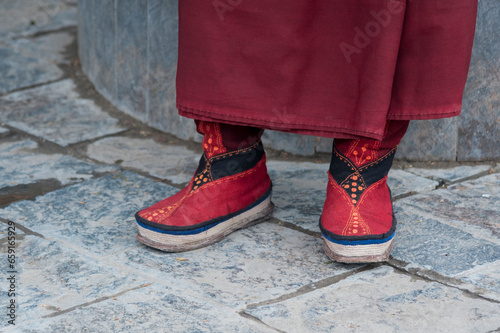 Typical Tibetan shoes of a Tibetan Pilgrim inside the Jokhang Temple in Lhasa, Tibet. It is one of the famous Buddhist monasteries in Lhasa
