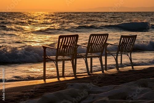 Chairs resting by the sea during the setting sun. Generative AI © Edward