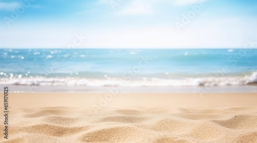 Seascape abstract beach background blur bokeh light of calm sea and sky Focus on sand foreground 