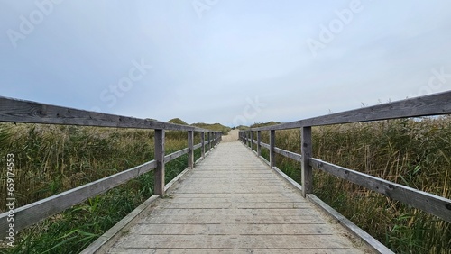 wooden bridge over the lake © Ricky Hoffmann