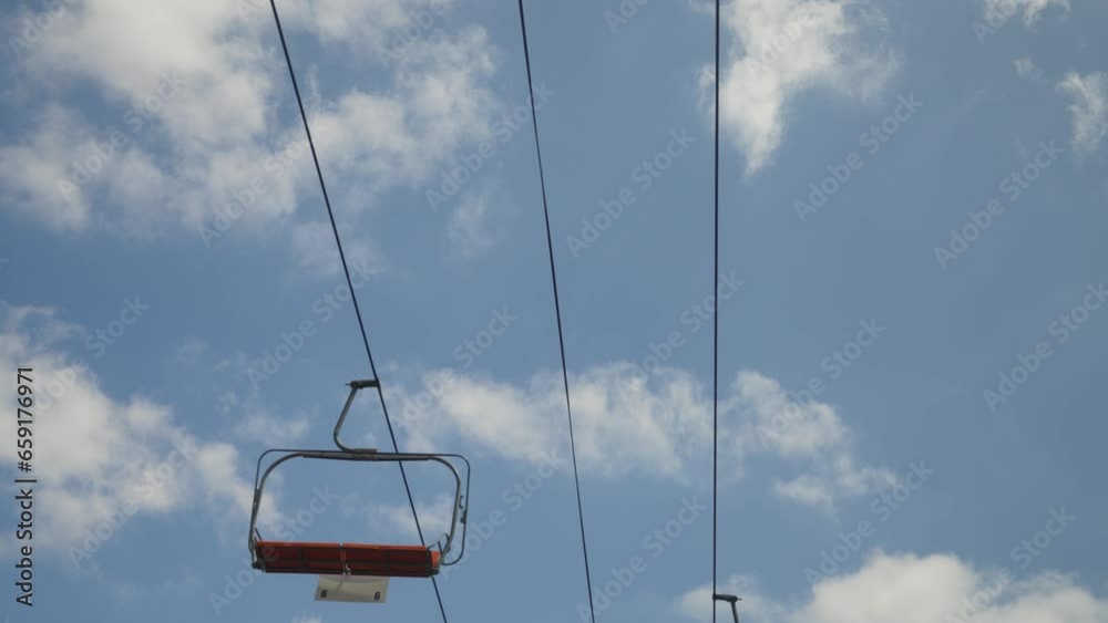 Tram ride with blue skies and clouds moving slow at a county fair Tram ride with blue skies and clouds moving slow at a county fair