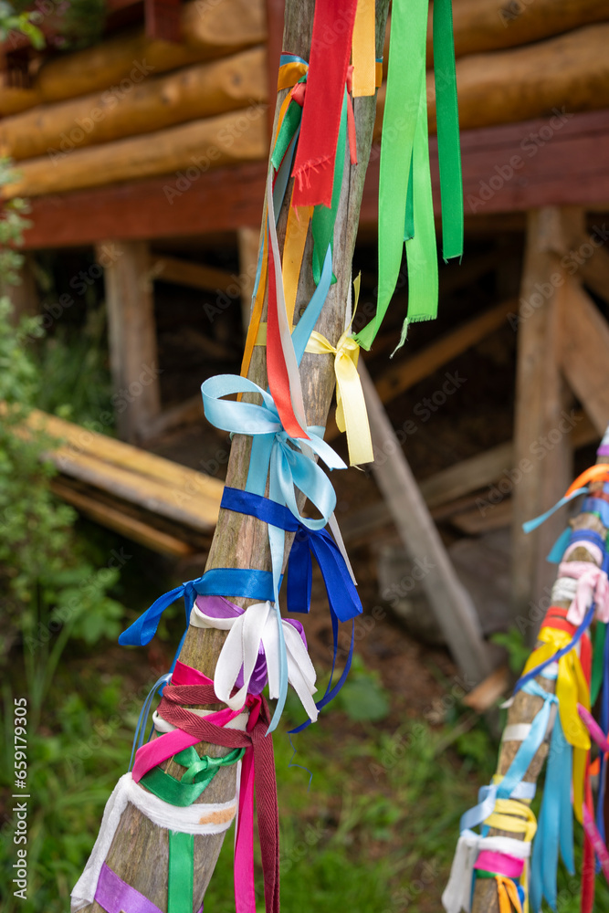 Teletskoye Lake, Altai Republic. The tradition of tying ribbons to trees for good luck and wish fulfillment