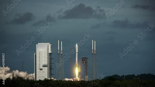 Spectacular shot of a Space Rocket blasting off from launch pad as it flies to space carrying satellites.  4K. Slow-motion. Includes sound and audio.