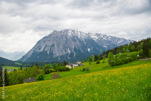 Summer austrian landscape with Grimming mountain (2.351 m), an isolated peak in the Dachstein Mountains, view from small alpine village Tauplitz, Styria, Austria