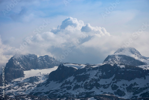 Amazing mountains panorama from "5 Fingers" viewing platform in the shape of a hand with five fingers on Mount Krippenstein in the Dachstein Mountains of Upper Austria, Salzkammergut region, Austria. © Aron M  - Austria