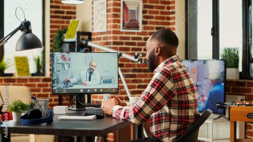 Photos Remotely working employee in telemedicine video call asking for medical advice, feeling sick