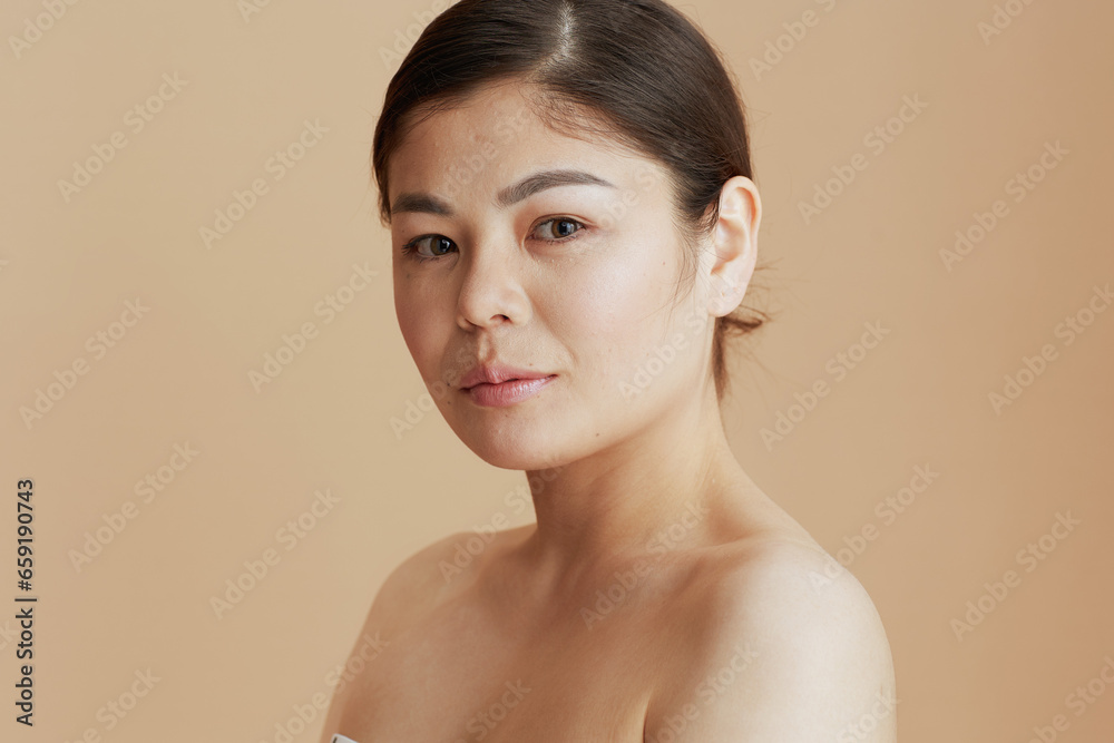 Portrait of young asian female looking in camera Portrait of young asian female looking in camera