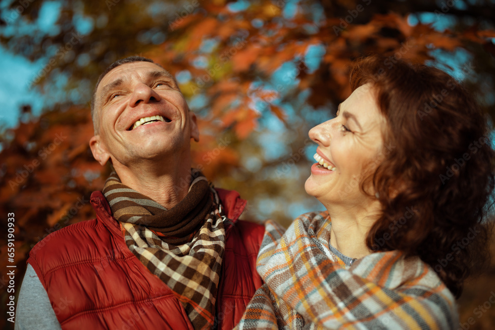 smiling romantic couple in park having good time smiling romantic couple in park having good time