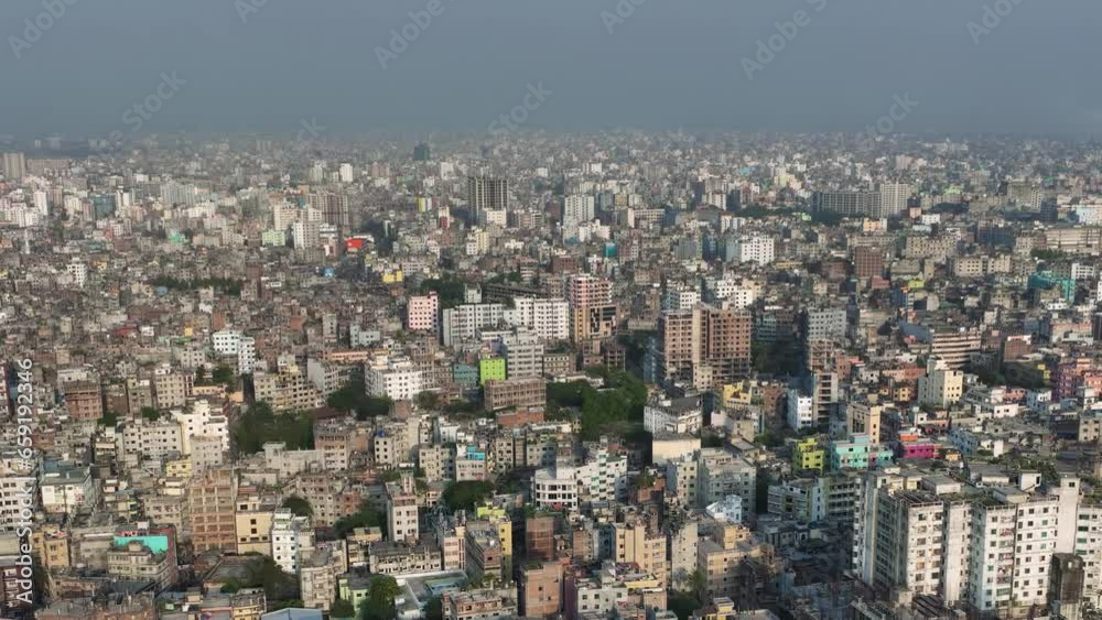 Aerial view of Dhaka city, the vibrant and bustling capital of Bangladesh. The cosmopolitan city is a blend of modern and traditional, with towering skyscrapers, bustling markets. Buriganga Aerial view of Dhaka city, the vibrant and bustling capital of Bangladesh. The cosmopolitan city is a blend of modern and traditional, with towering skyscrapers, bustling markets. Buriganga