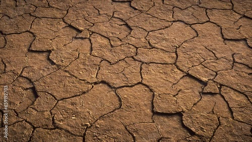 Dry soil with cracks, closeup on dried desert land.