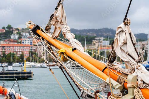 Details of fishing boat docked at harbor. Leisure activity, sport and recreation, traditional craft, environmental damage concepts. Sea fishing, ship marine industry, fish vessel. photo