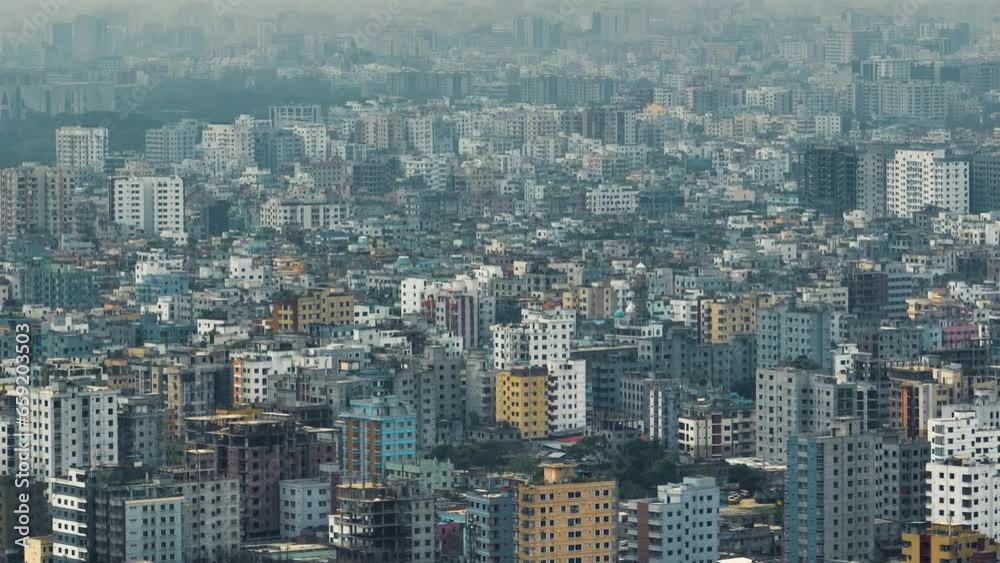 Aerial view of Dhaka city, the vibrant and bustling capital of Bangladesh. The cosmopolitan city is a blend of modern and traditional, with towering skyscrapers, bustling markets. Buriganga Aerial view of Dhaka city, the vibrant and bustling capital of Bangladesh. The cosmopolitan city is a blend of modern and traditional, with towering skyscrapers, bustling markets. Buriganga