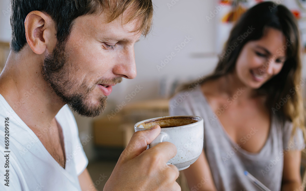 Young man drinking coffee at home Young man drinking coffee at home