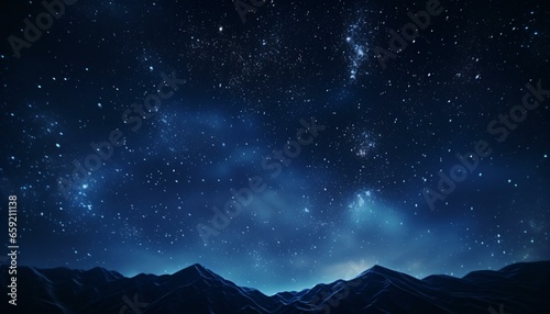 Fotografiet A starry night sky over majestic mountains
