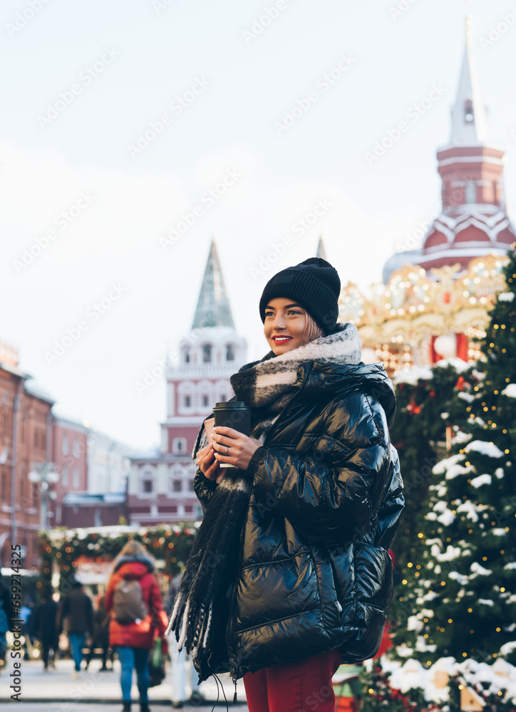 Beautiful woman standing on Red Square decorated with Christmas trees Beautiful woman standing on Red Square decorated with Christmas trees