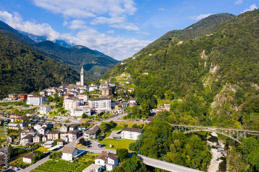 View from drone of houses of village Intragna in mountain valley in sunny summer day