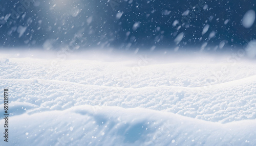 Beautiful ultrawide background image of light snowfall falling over of snowdrifts.