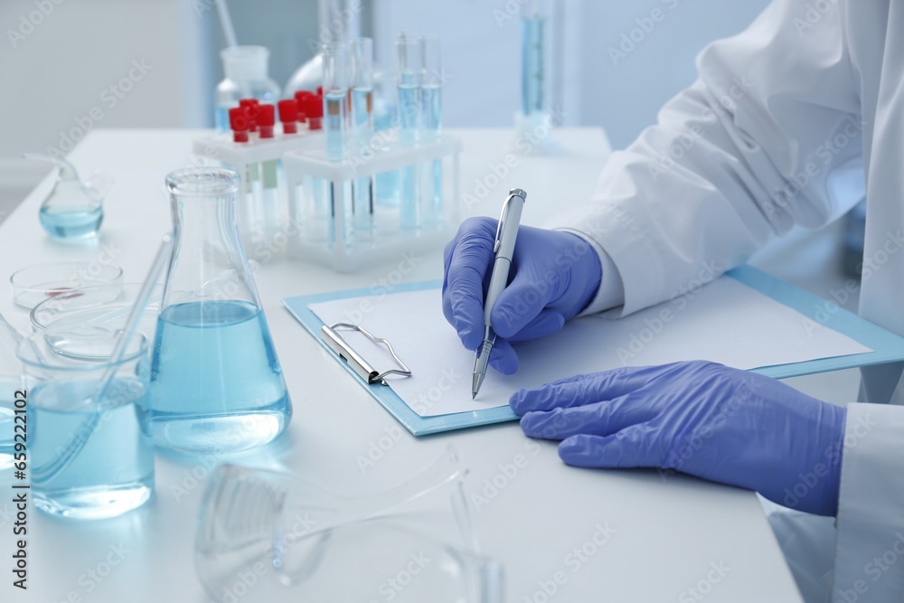 Scientist working in laboratory, closeup. Medical research