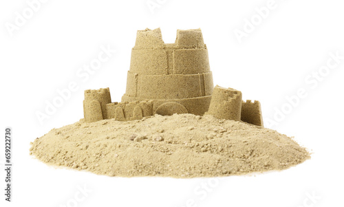 Pile of sand with beautiful castle isolated on white photo