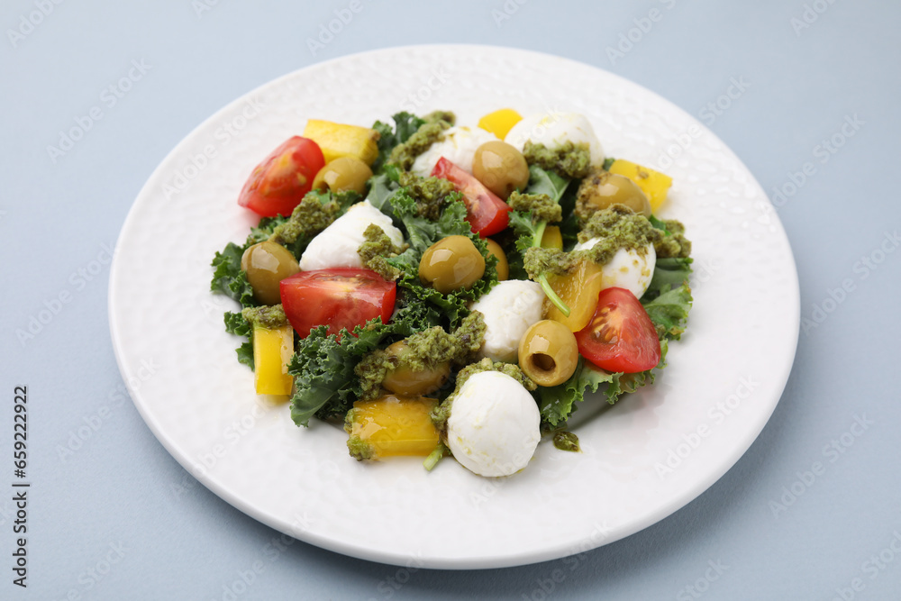 Delicious salad with pesto sauce on light grey table, closeup Delicious salad with pesto sauce on light grey table, closeup
