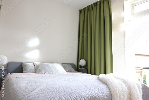 Stylish room interior with comfortable large bed © New Africa