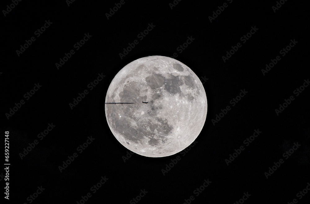 Fototapeta premium moon and airplane at night