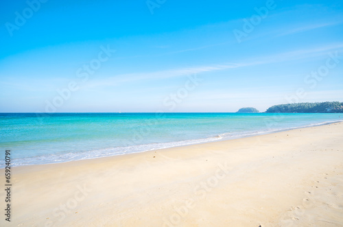 Empty tropical beach and seascape, Beautiful sandy beach and sea in sunny day,Blue sky in good weather day, Beach sea space area nature background © panya99