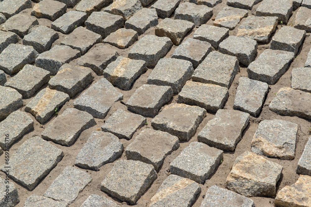 Cobblestones forming a background. Paving stones used in the streets of Brazil.