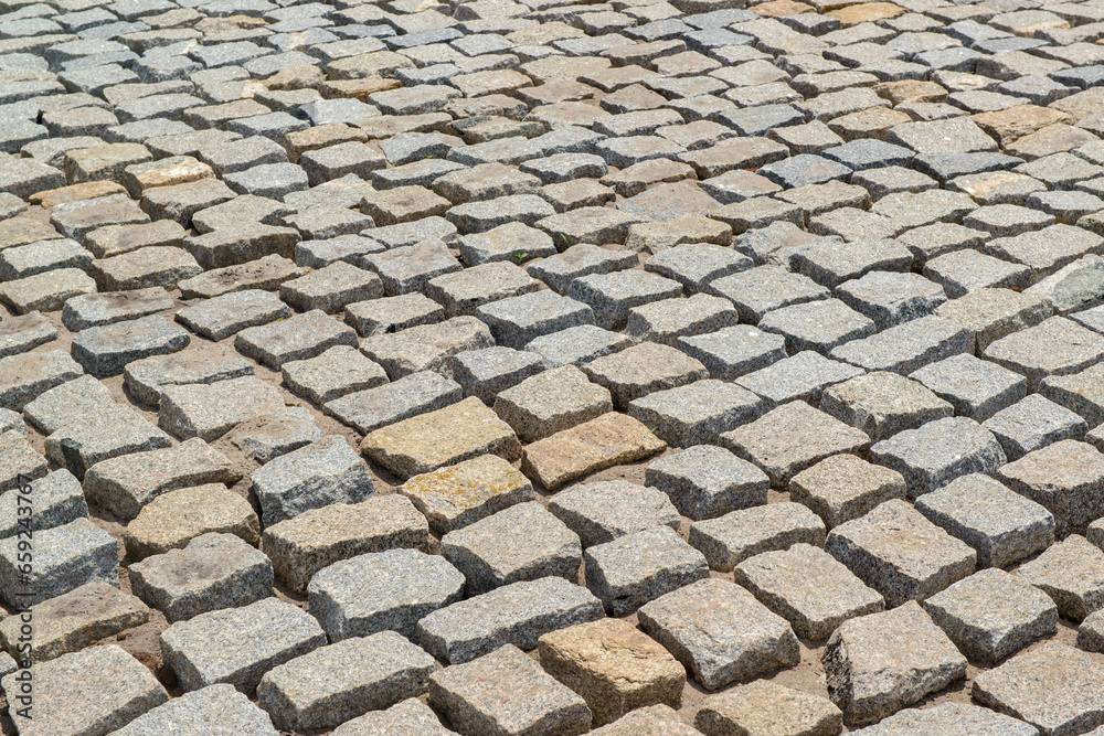 Cobblestones forming a background. Paving stones used in the streets of Brazil.