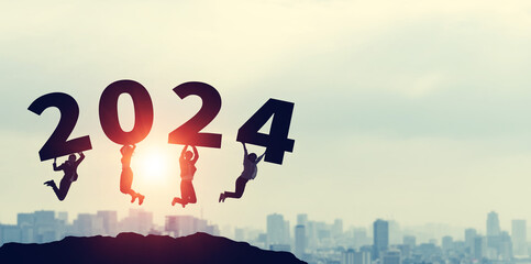 Group of jumping multinational people. 2024 New Year concept. New year's card 2024. Wide angle visual for banners or advertisements.