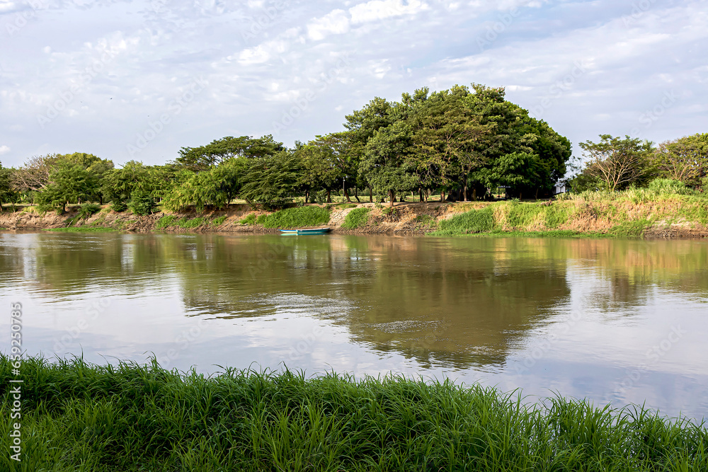 Fototapeta premium Beautiful rural view of an arm of the Magdalena River in the city of Mompox, Colombia.