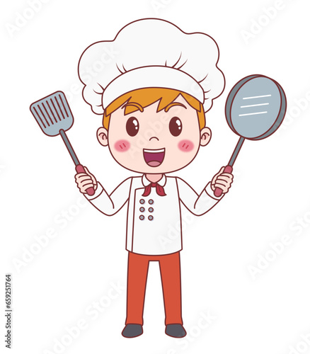 Cheerful boy in chef uniform with spatula and pan in hands