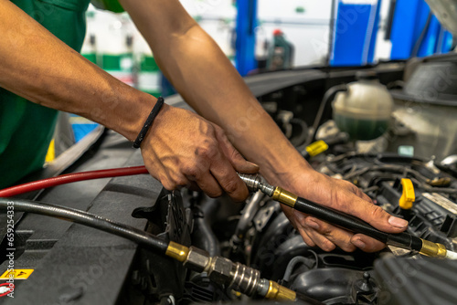 Close up view of a Maintenance Car service - auto oil change, motor check, brake cleaning, tire check, engine inspection, motor oil-brake inspection