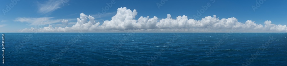 White cumulus clouds above blue Ocean White cumulus clouds above blue Ocean